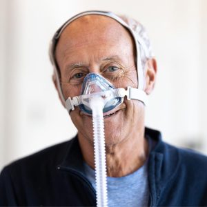 Sleepnet IQ 2 Nasal CPAP Mask being worn by man | CPAP.co.uk