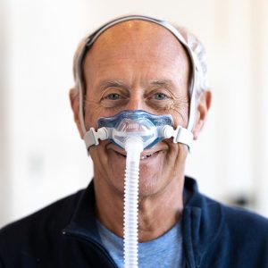 Sleepnet Phantom 2 Nasal Cushion CPAP Mask being worn by man | CPAP.co.uk